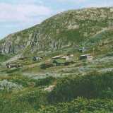 augNorwayHousesOnMountain
